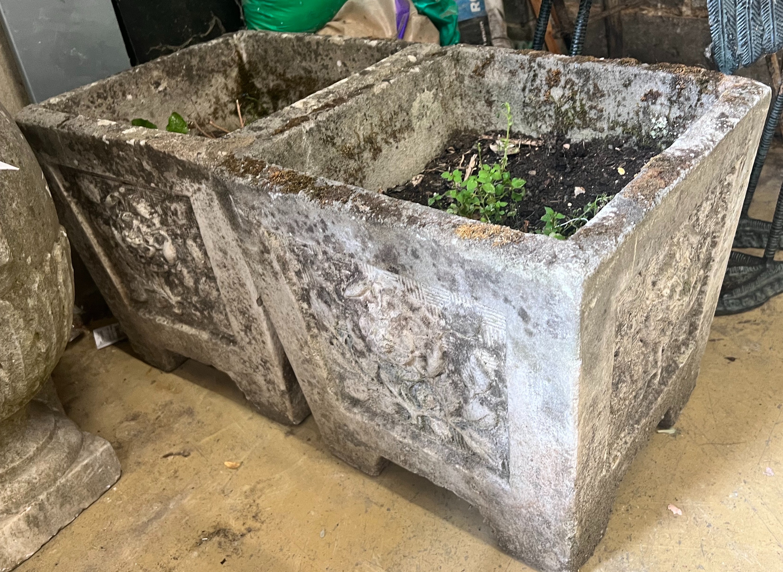 A pair of reconstituted stone square planters with rose motif, width 37cm height 36cm
